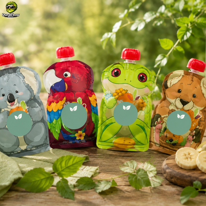 Quatre gourdes à compote aux motifs animalier dans un décore de verdure.